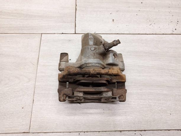 Суппорт задний левый Ford / Mazda / Volvo 1365653
