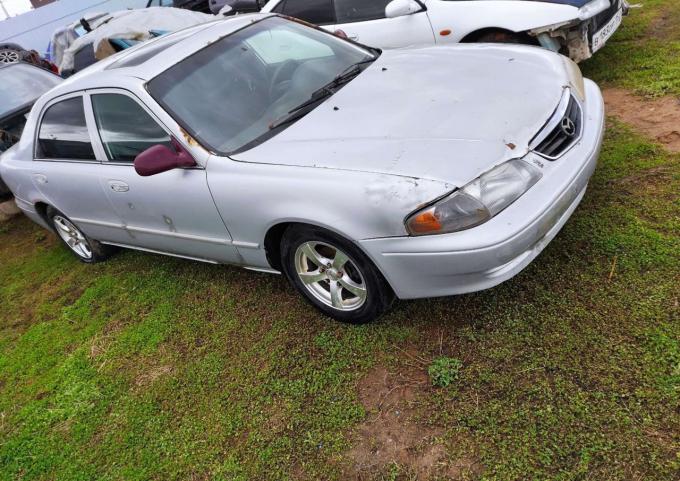 В разборе mazda 626 GF LX USA